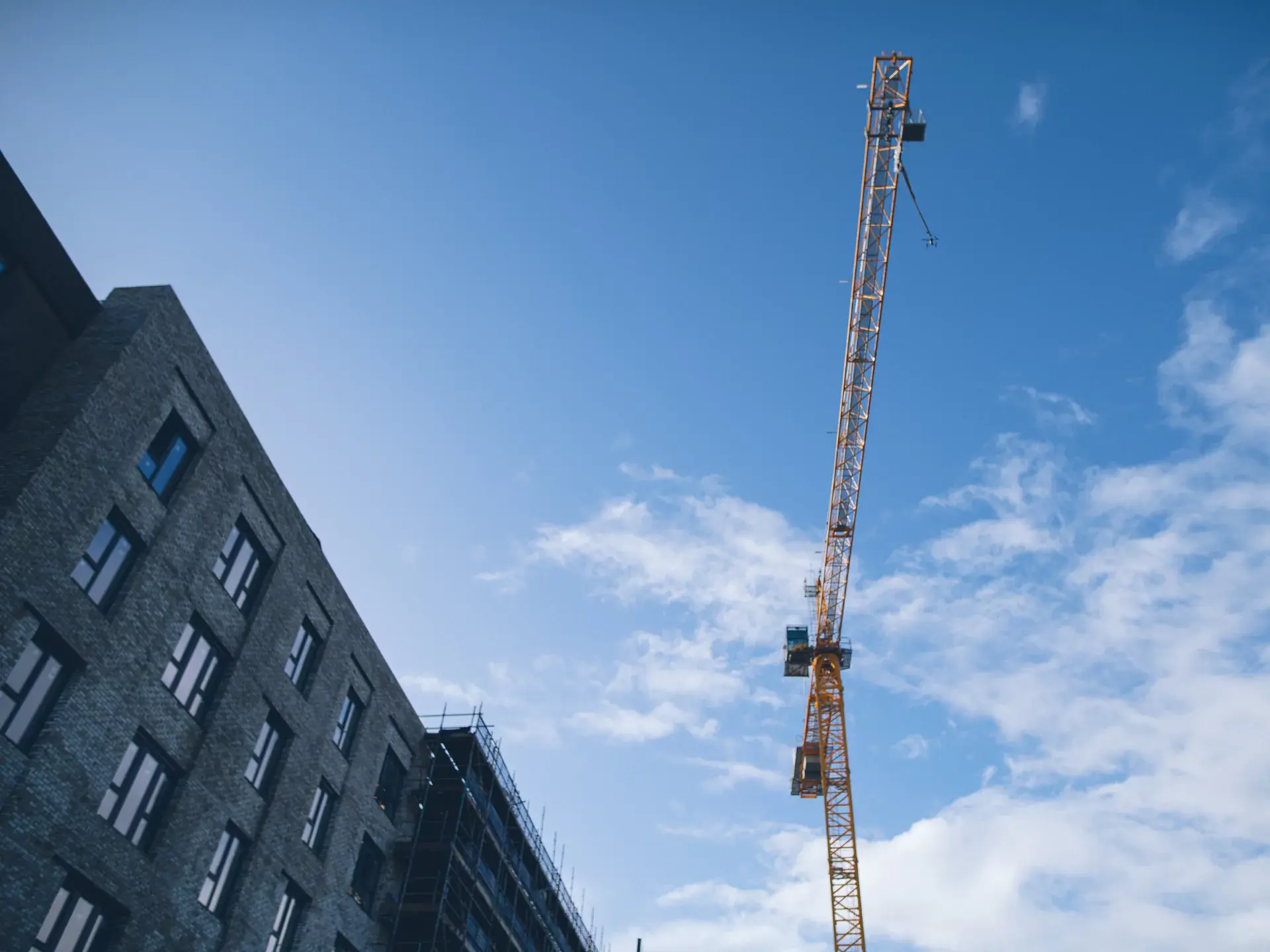Image of a construction crane taken from below