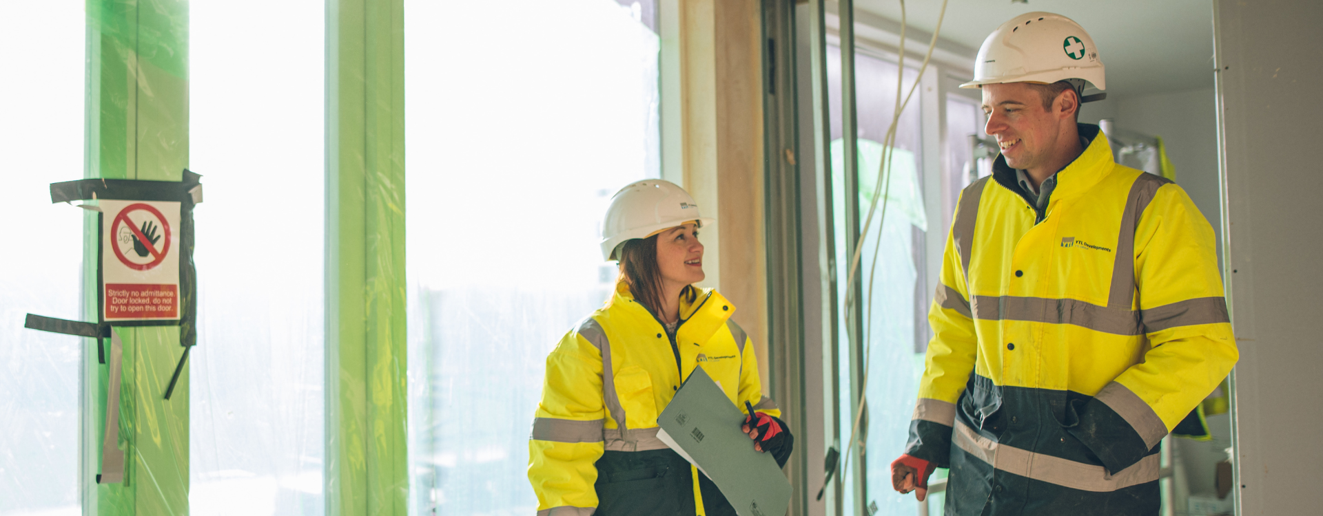 Two YTL Developments employees smiling
