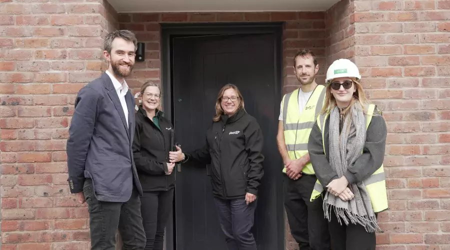 Soverign Network Group outside brick home at Brabazon.
