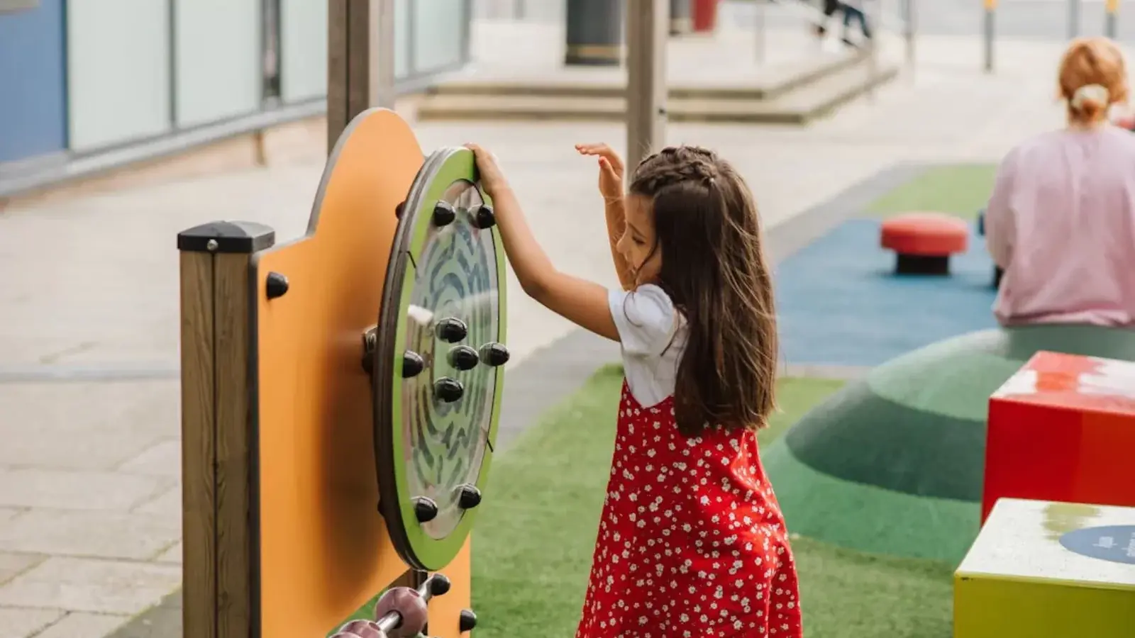 Image of a child playing with park apparatus